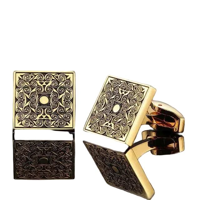 Gold square cufflinks with intricate patterns on a white background