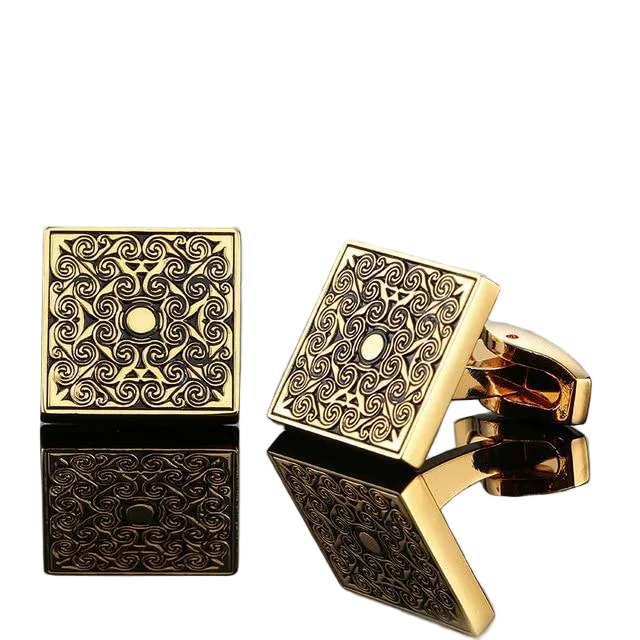 Gold square cufflinks with intricate patterns on a gray background