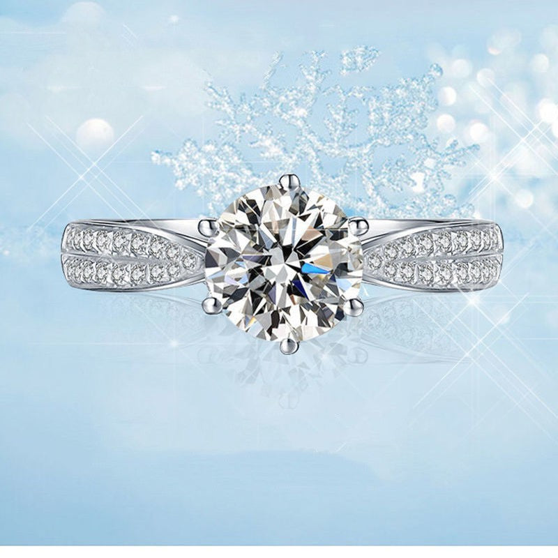 Diamond ring on a light blue background with snowflake decorations