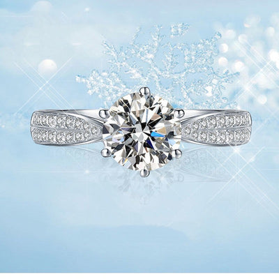 Diamond ring on a light blue background with snowflake decorations