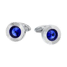 Silver cufflinks with blue gemstones on a white background