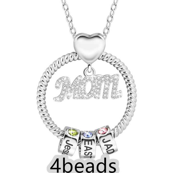 Silver necklace with heart pendant and name beads on a white background 4 beads