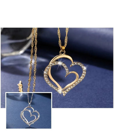 Gold heart-shaped necklace with a close-up inset on a blue background
