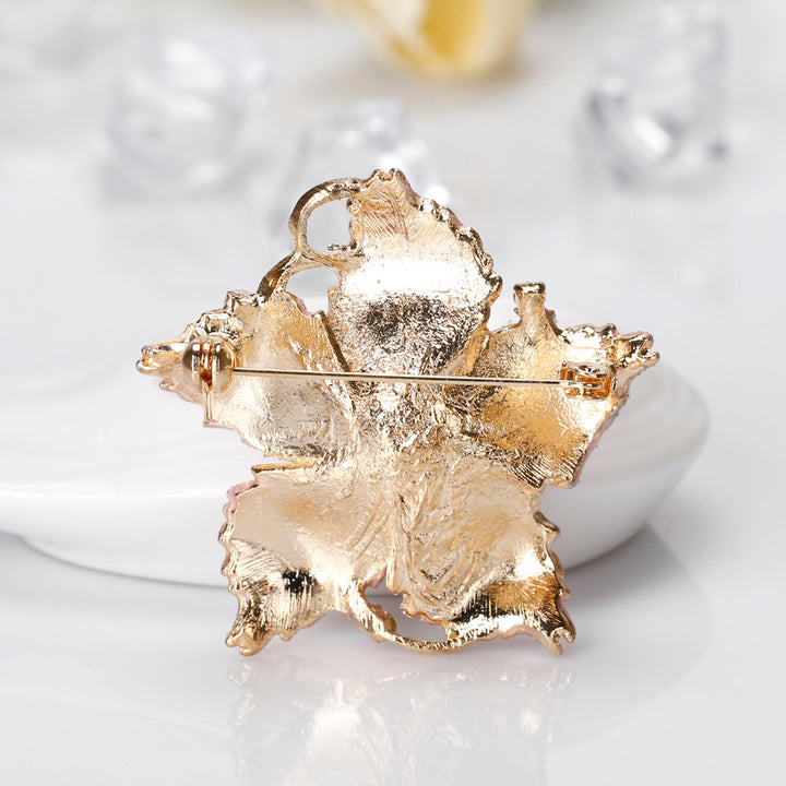 back side and pin view of the Pink floral brooch on a white background