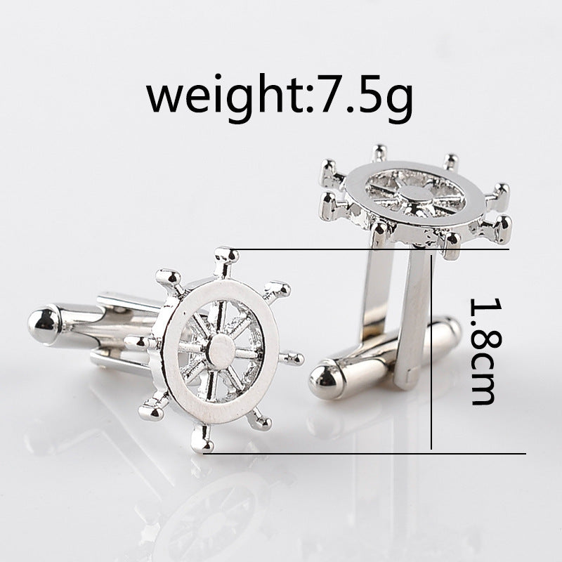 Silver steering wheel cufflinks with measurements on a white background
