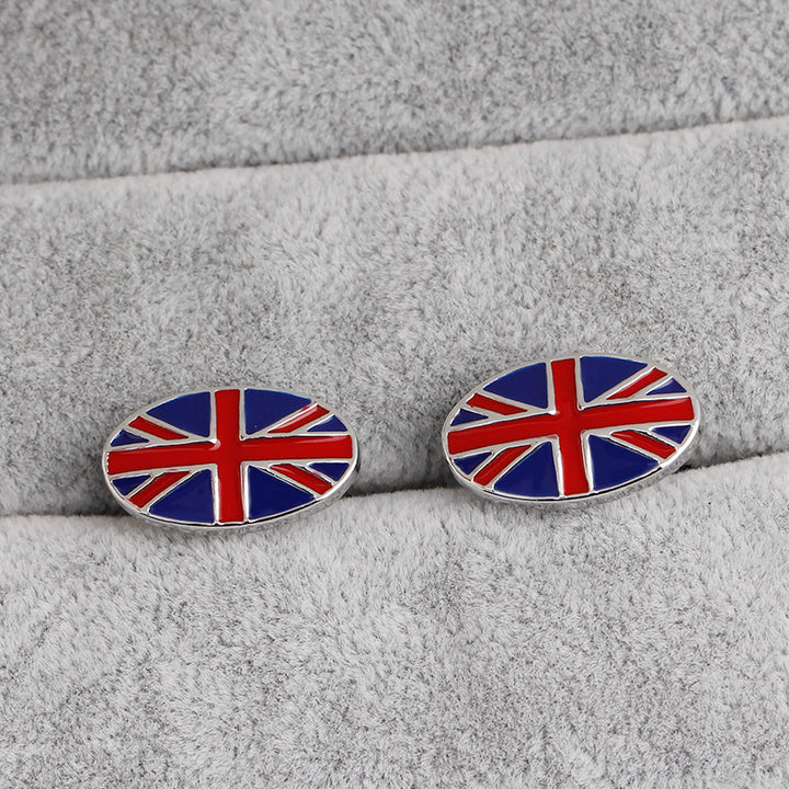 Cufflinks with a Union Jack design on a gray fabric background