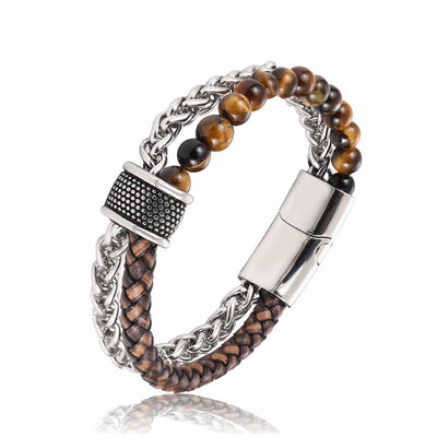 Multistrand bracelet with braided leather, beaded stones, and metal clasp on a white background
