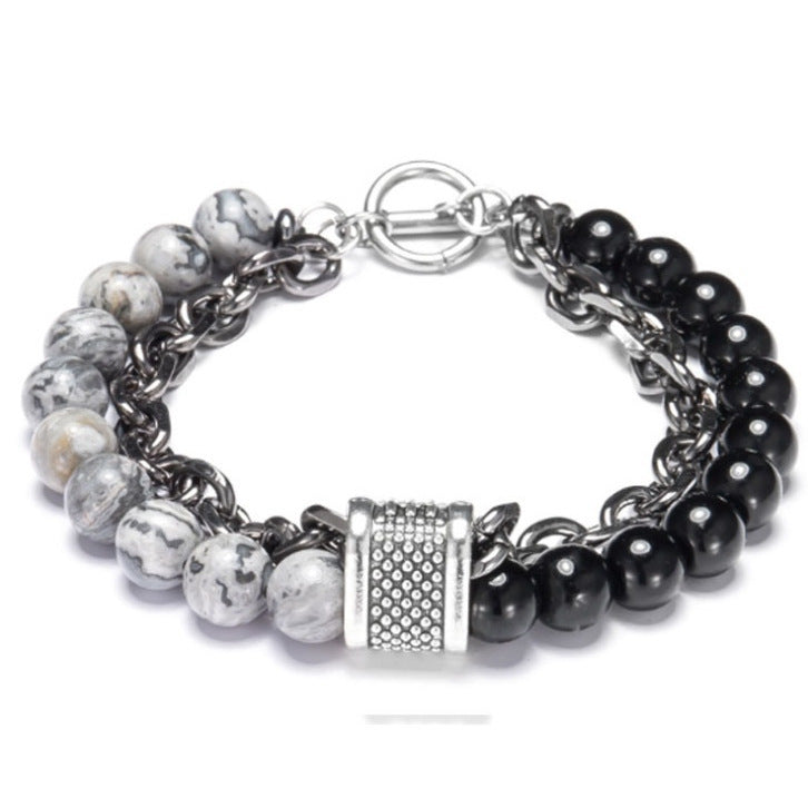 Multistrand bracelet with beads and metal clasp on a white background