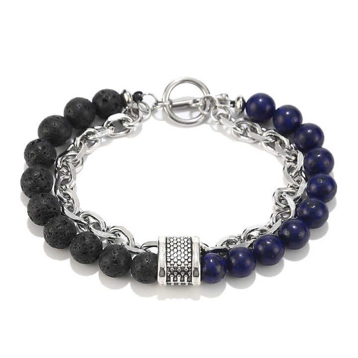 Bracelet with black and blue beads and silver chain on a white background
