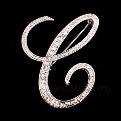 Silver brooch with letter &