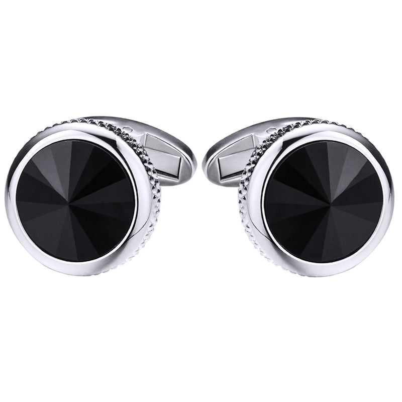 Pair of black gemstone cufflinks with silver borders on a white background
