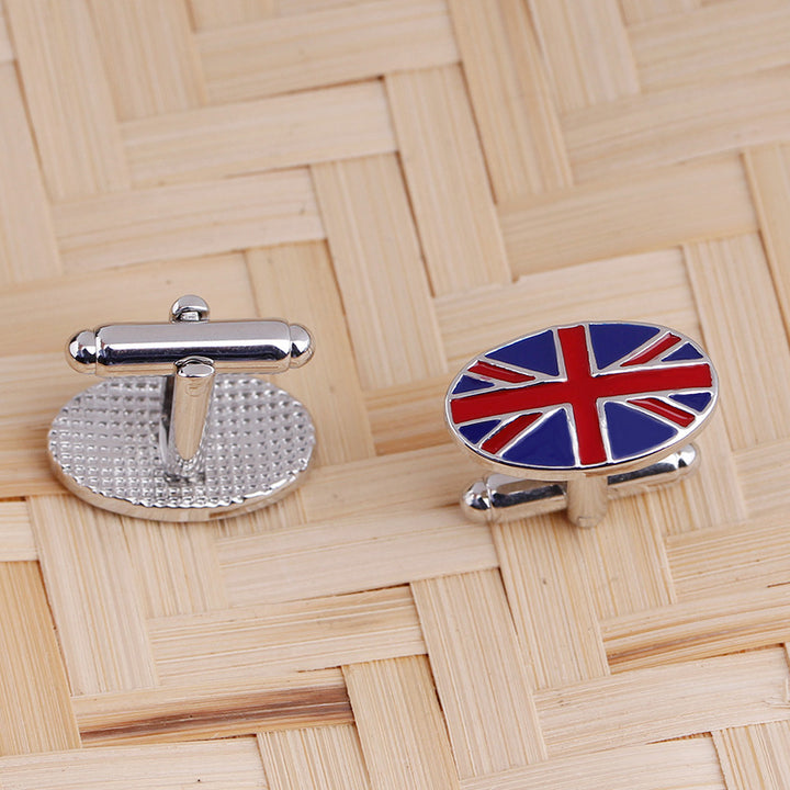 Cufflinks with a Union Jack design on a wooden background