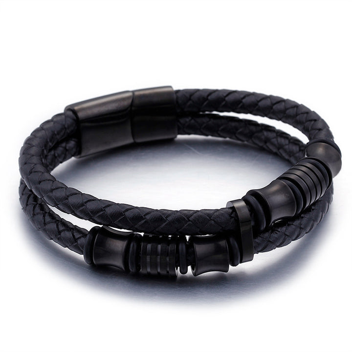 Black braided leather bracelet with black metal accents on a white background