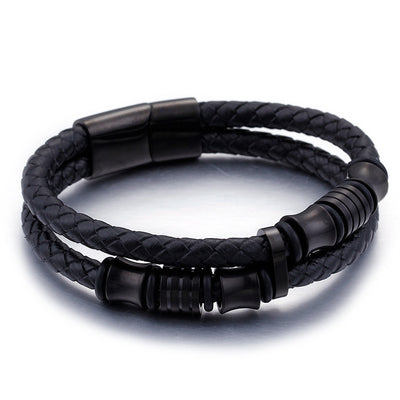 Black braided leather bracelet with black metal accents on a white background