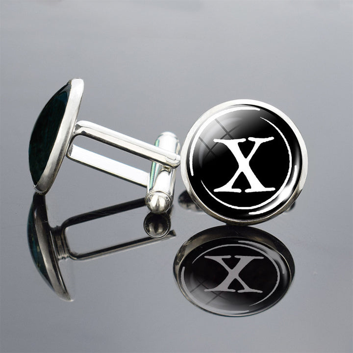 Cufflinks with a black circle and white letter &