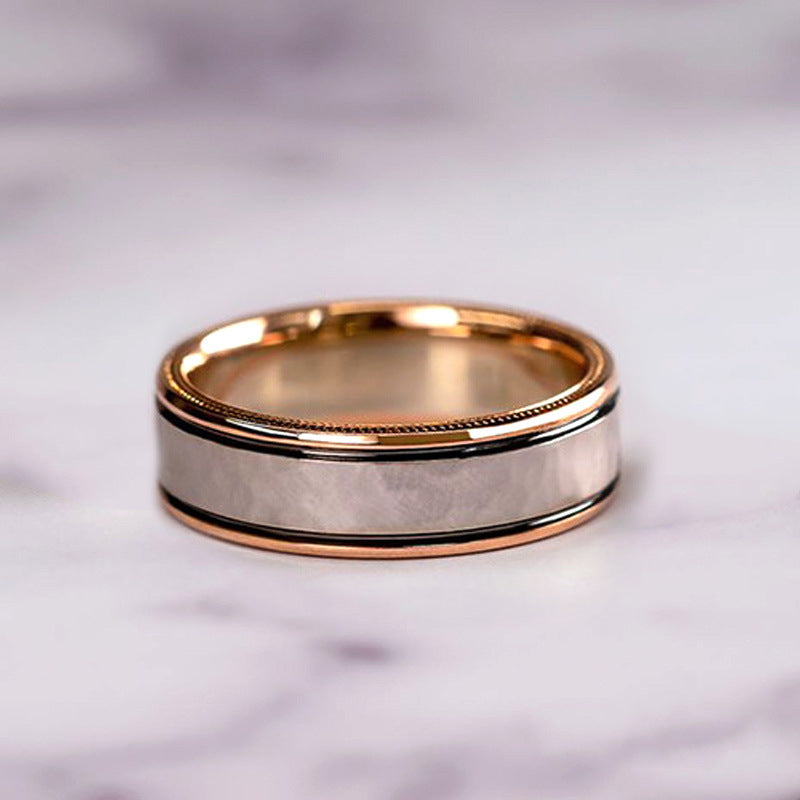 rose gold wedding bands on a marble surface