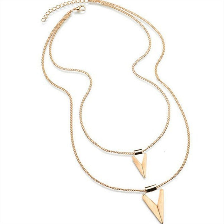 Gold necklace with triangle pendants on a white background
