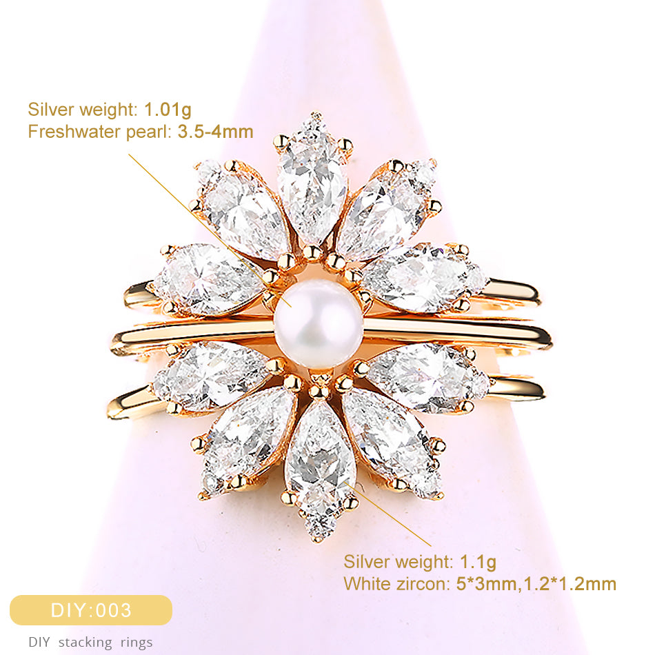 Gold ring with pearls and zircons on a pink background