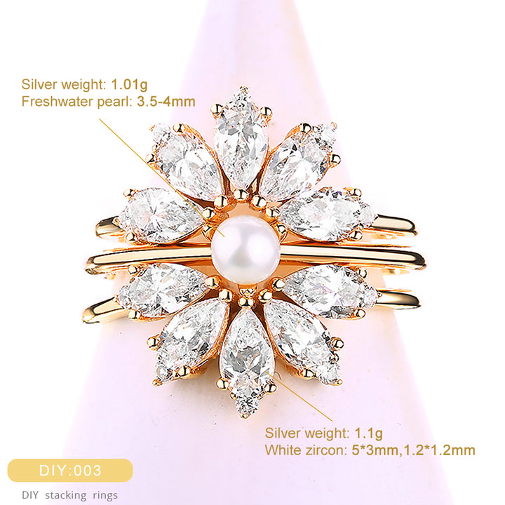 Gold ring with pearls and zircons on a pink background