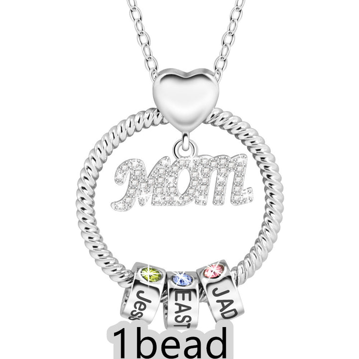 Silver necklace with heart pendant and name charms on a white background 1 bead