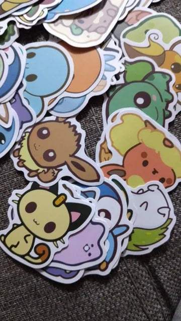 Collection of colorful cartoon stickers on a textured surface