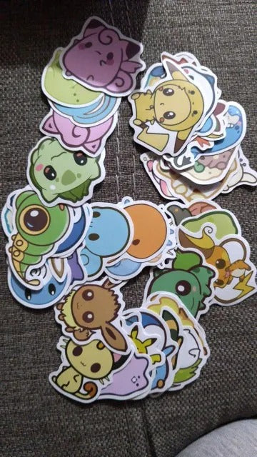 Set of colorful cartoon stickers on a dark surface