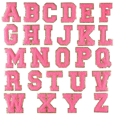Pink letters of the alphabet with gold edges on a white background