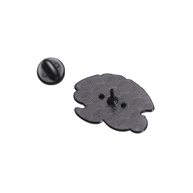 Back of a enamel pin with a central knob on a white background