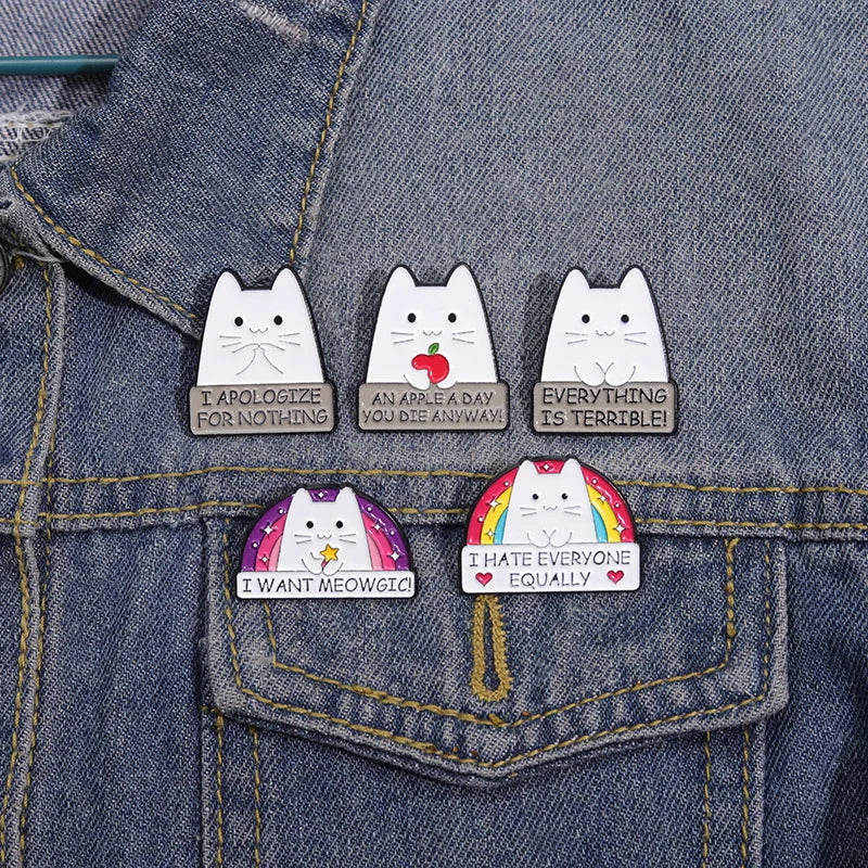 Cat-themed pins on a denim jacket