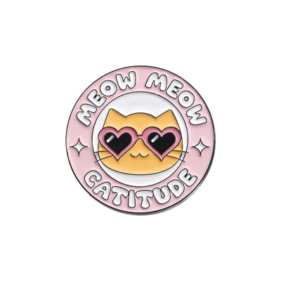Circular badge with a cat face, heart-shaped eyes, and 'MEOW MEOM CATITUDE' text on a pink background.