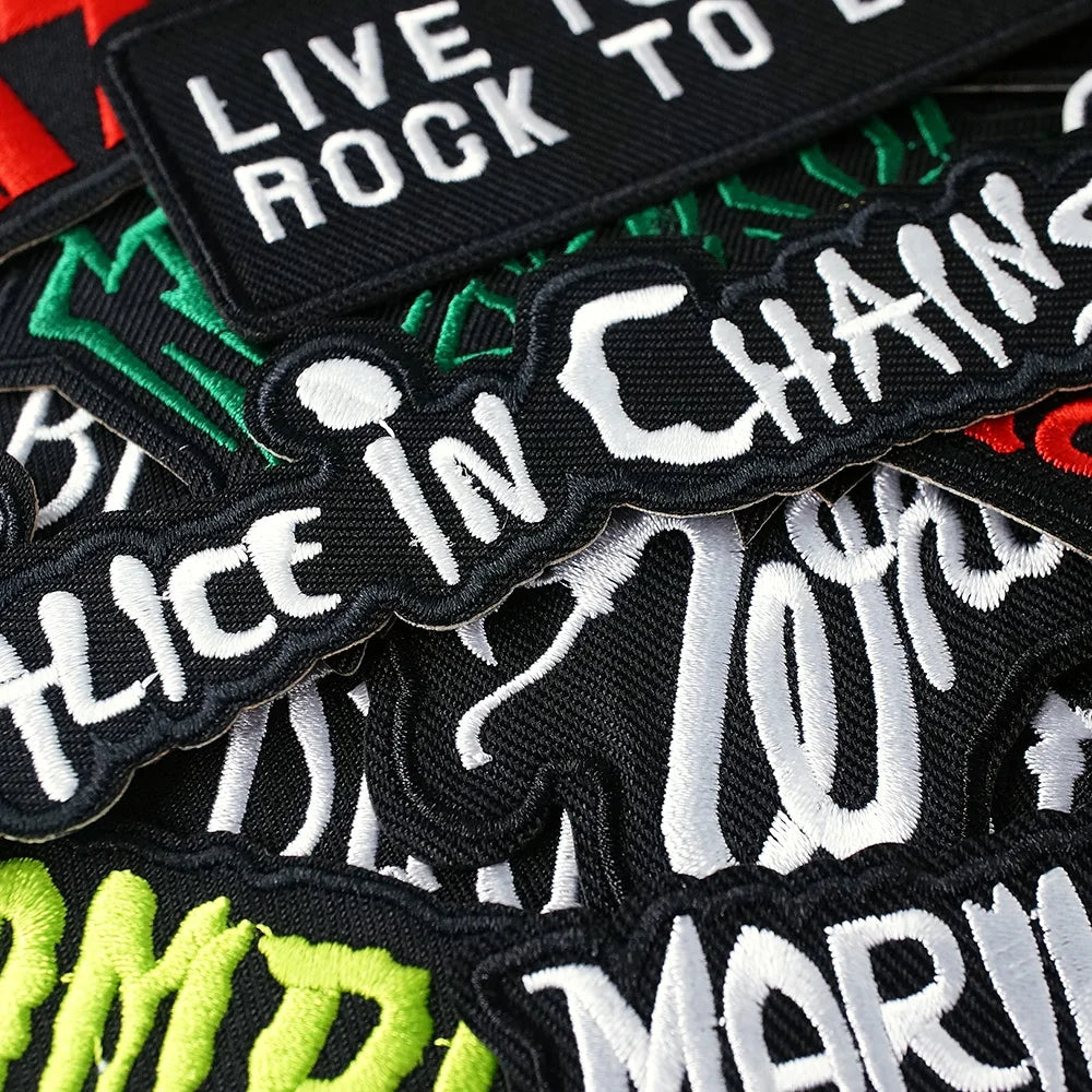Collection of Alice in Chains patches with text on a black background