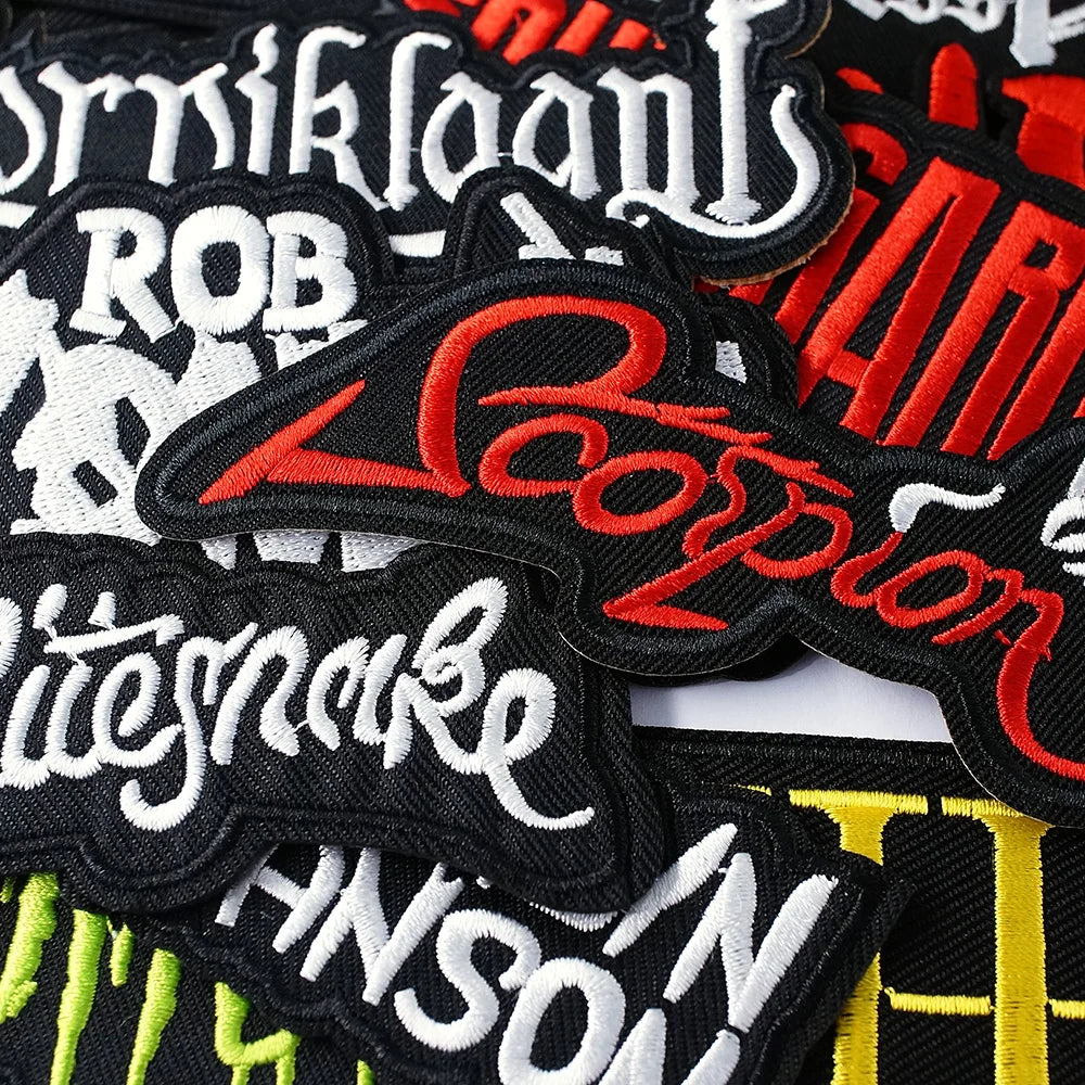 Collection of embroidered patches with various names and designs.