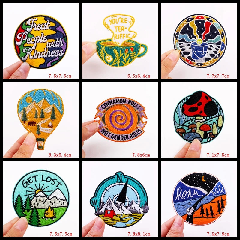 Collection of colorful round stickers held by hands with visible text and designs.