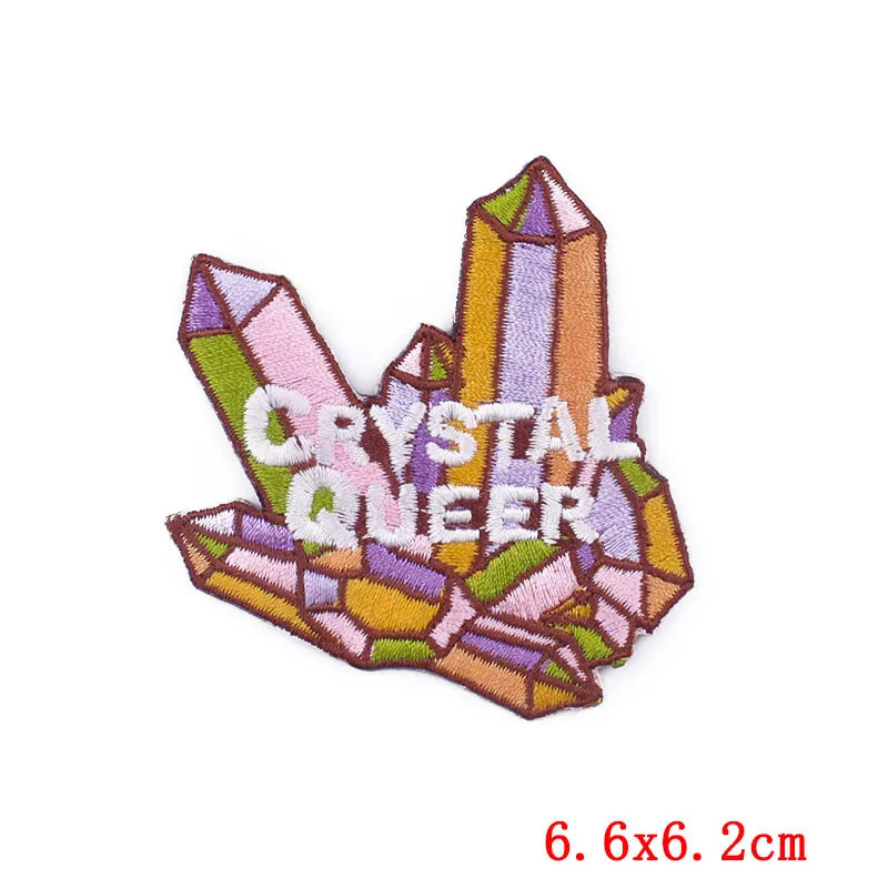 Embroidered patch with crystal design and 'Crystal Queer' text on a white background