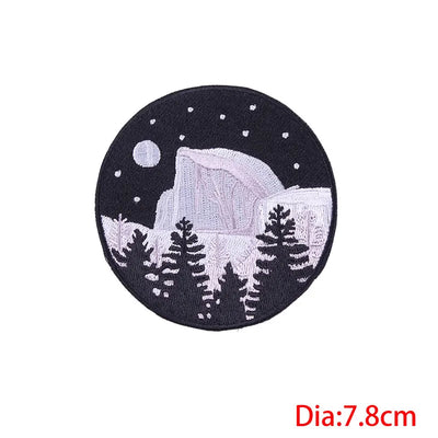 Circular patch with mountain and tree design on a black background, size indicated as 7.8cm.