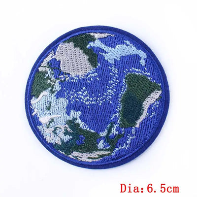 Circular patch with embroidered design of a world map on a white background