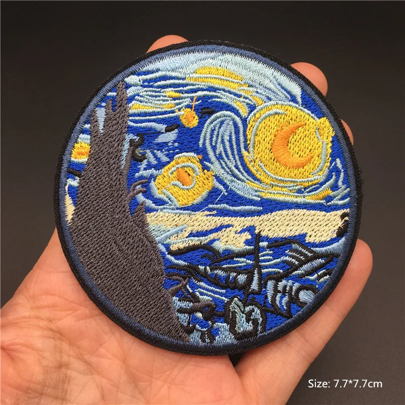 Embroidered patch resembling 'The Starry Night' held in a hand with a dark background