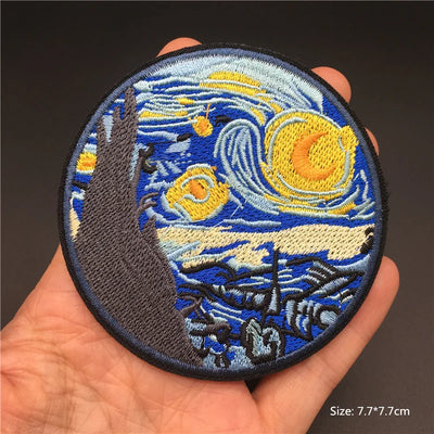 Embroidered patch resembling 'The Starry Night' held in a hand with a dark background
