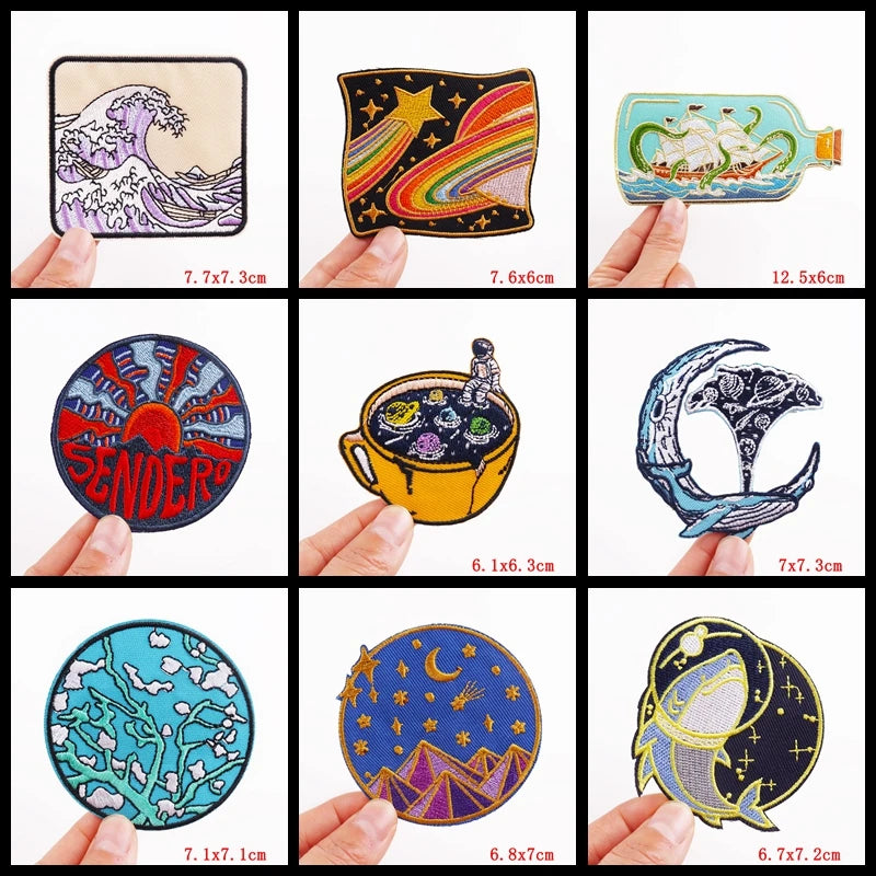 Collection of various artistic patches held by hands with dimensions displayed.