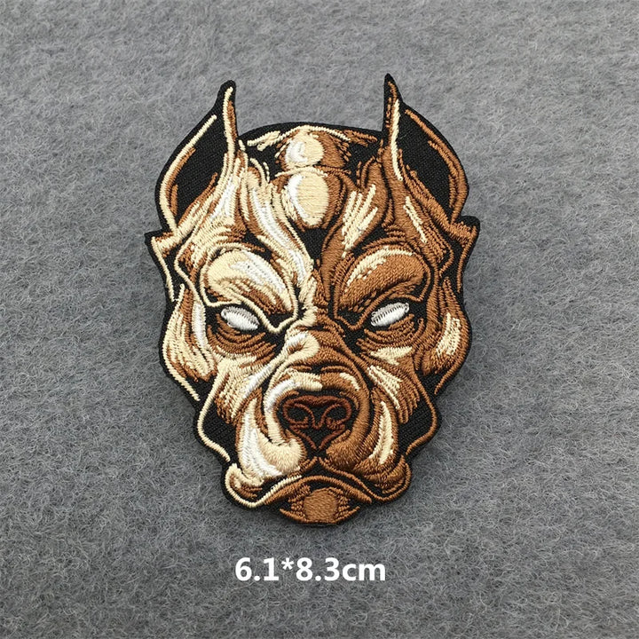 Dog head patch with brown and beige colors on a gray background