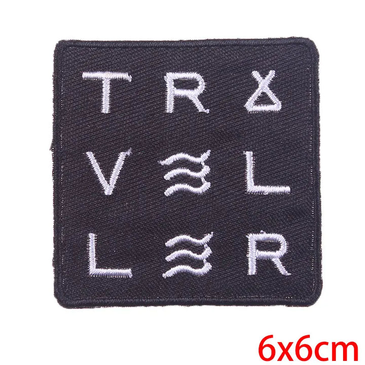 Black patch with white text and symbols on a white background