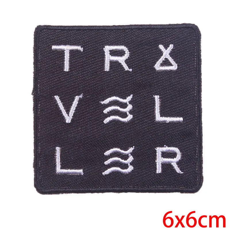 Black patch with white text and symbols on a white background