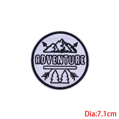 Circular patch with 'ADVENTURE' text and mountain design on a white background