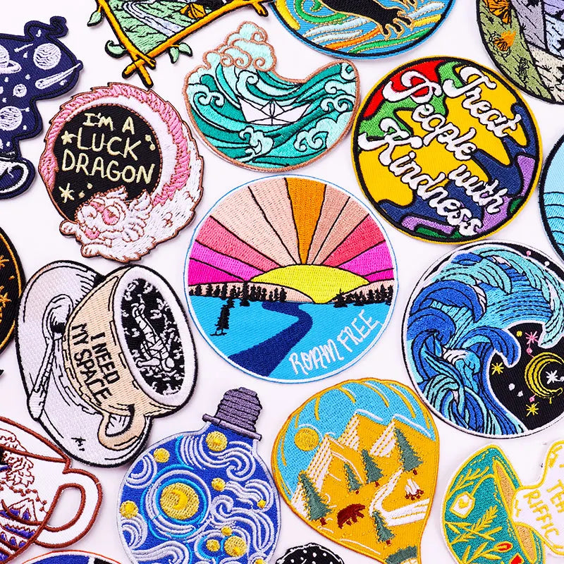 Collection of colorful embroidered patches with various designs on a white background