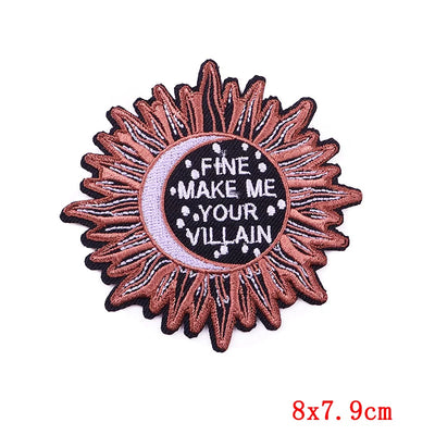 Embroidered patch with sunflower design and text on a white background