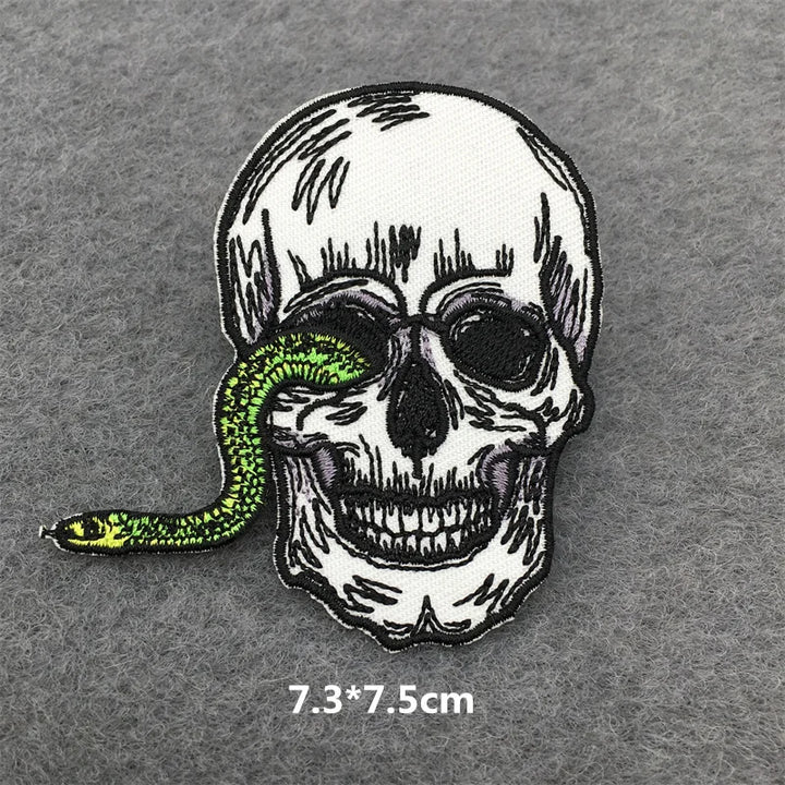 Skull with a green snake on a gray background