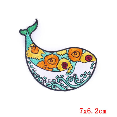 Colorful fish-shaped patch with floral patterns on a white background