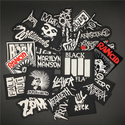 Collection of music band patches on a dark background