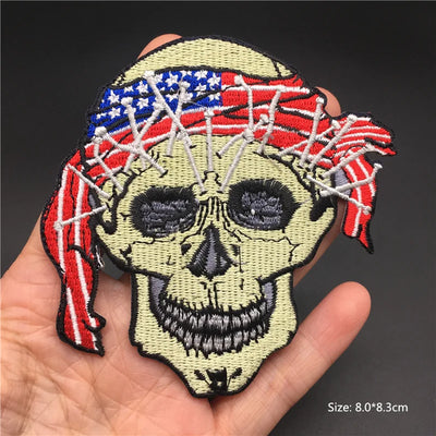 Embroidered patch of a skull with American flag headband held in hand