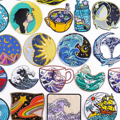 Collection of colorful embroidered patches with various designs on a white background